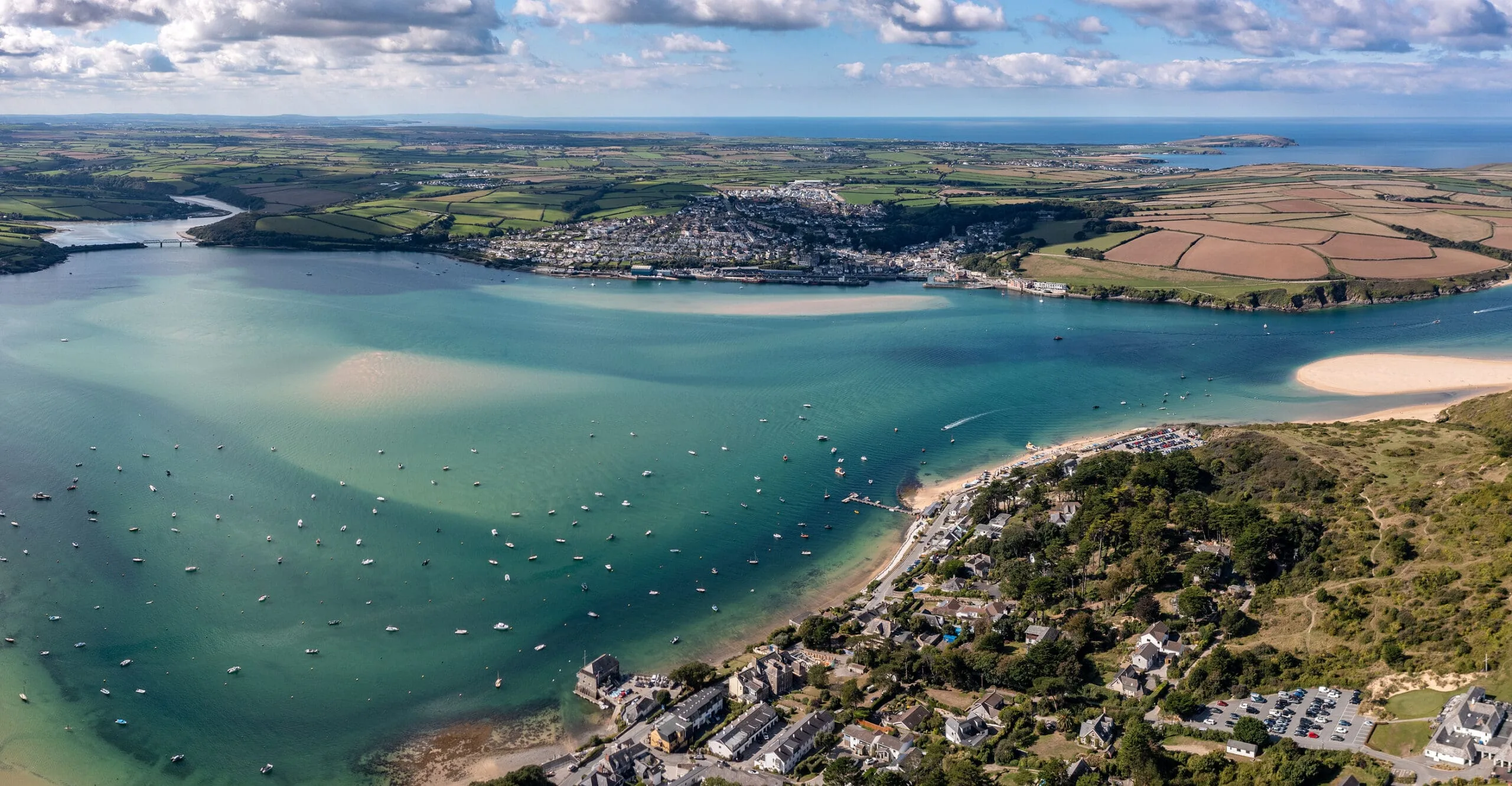 Aerial panorama view of the Padstow town and beach from Rock, Cornwall