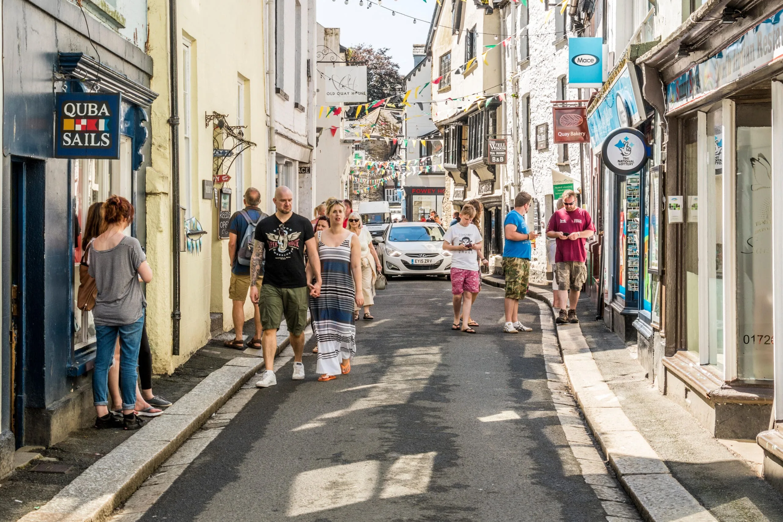 People enjoying a sunny day in Fowey, Cornwall