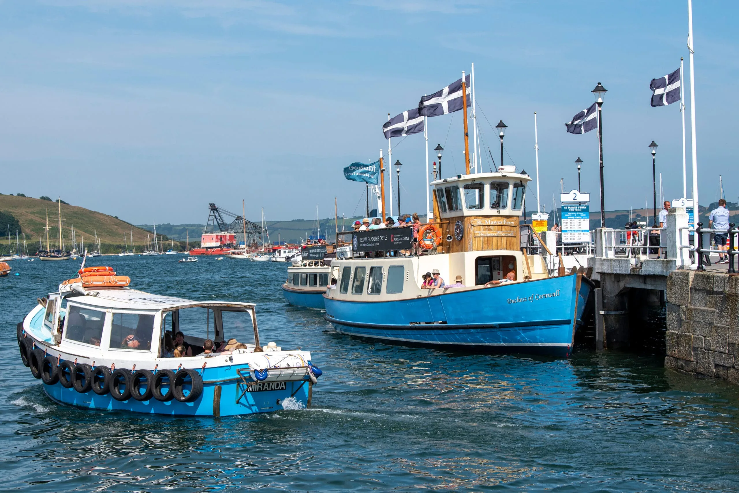 Passenger ferries sporting the Cornish flag docking in Falmouth, Cornwall